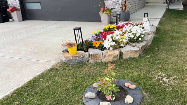 Natural Rocks flower bed on front side by MBD landscaping team 2025